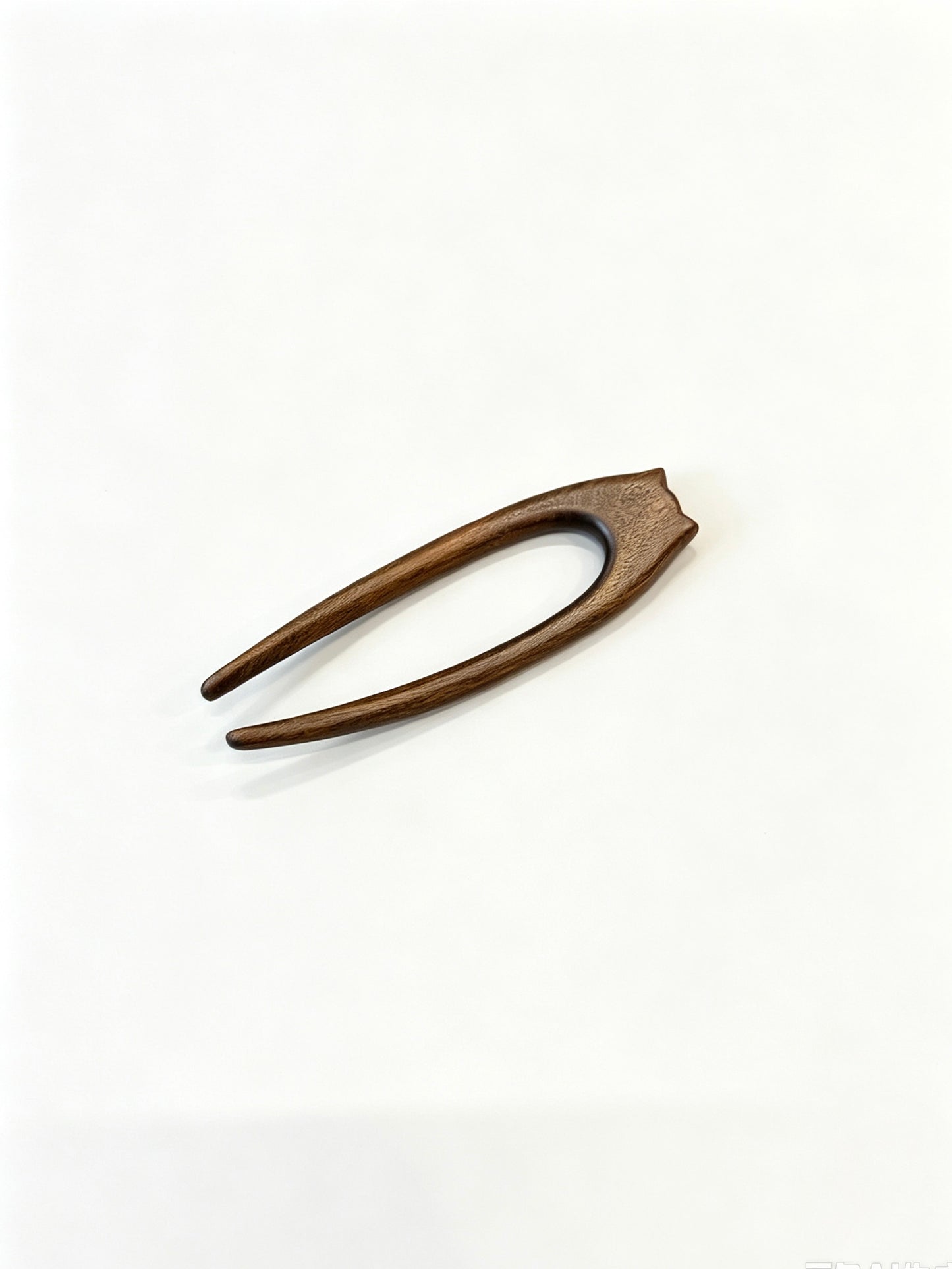 Cat double-prong sandalwood hair fork displayed on a white background