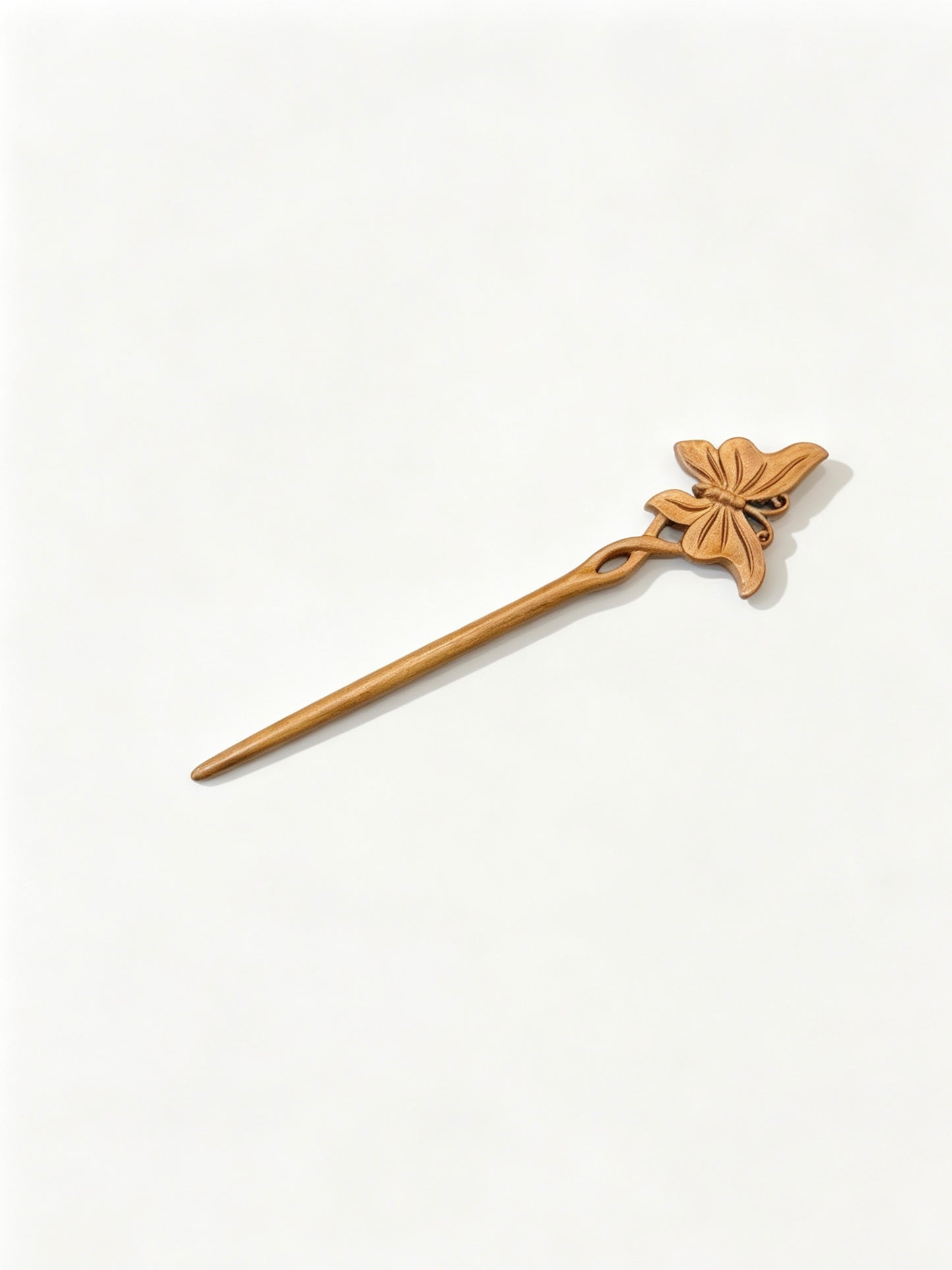 Butterfly carved hair stick displayed on a white background