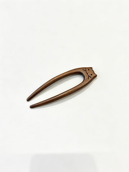 Cat double-prong sandalwood hair fork displayed on a white background