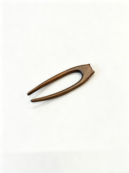 Cat double-prong sandalwood hair fork displayed on a white background