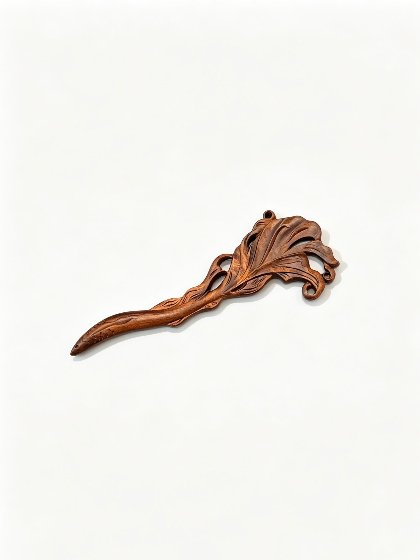 Fish carved sandalwood hair stick displayed on a white background