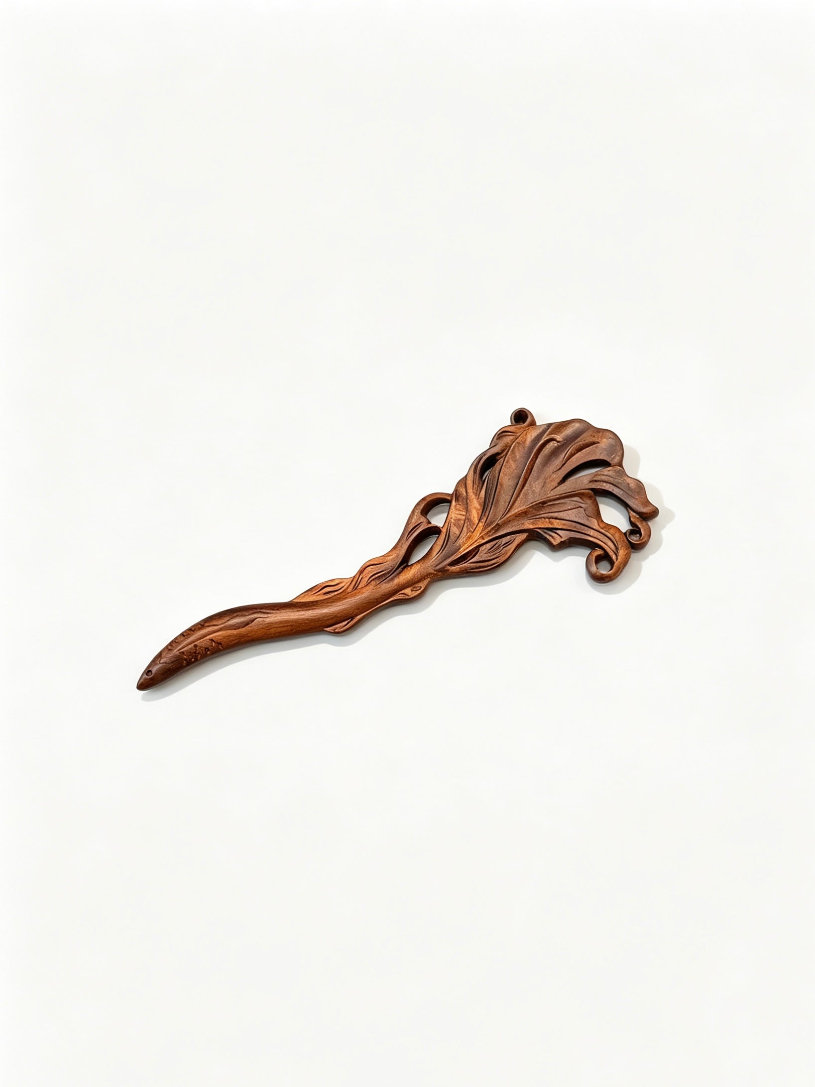 Fish carved sandalwood hair stick displayed on a white background