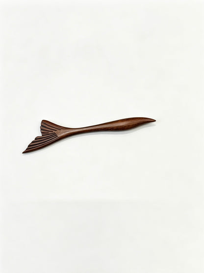 Fish tail sandalwood hair stick displayed on a white background