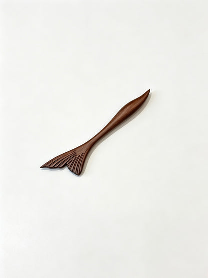 Fish tail sandalwood hair stick displayed on a white background