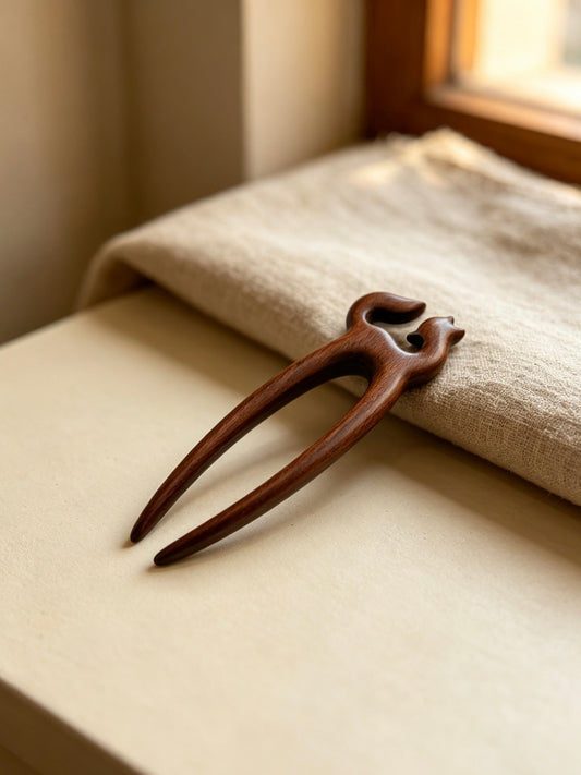 Fox double-prong hair fork displayed on a light surface