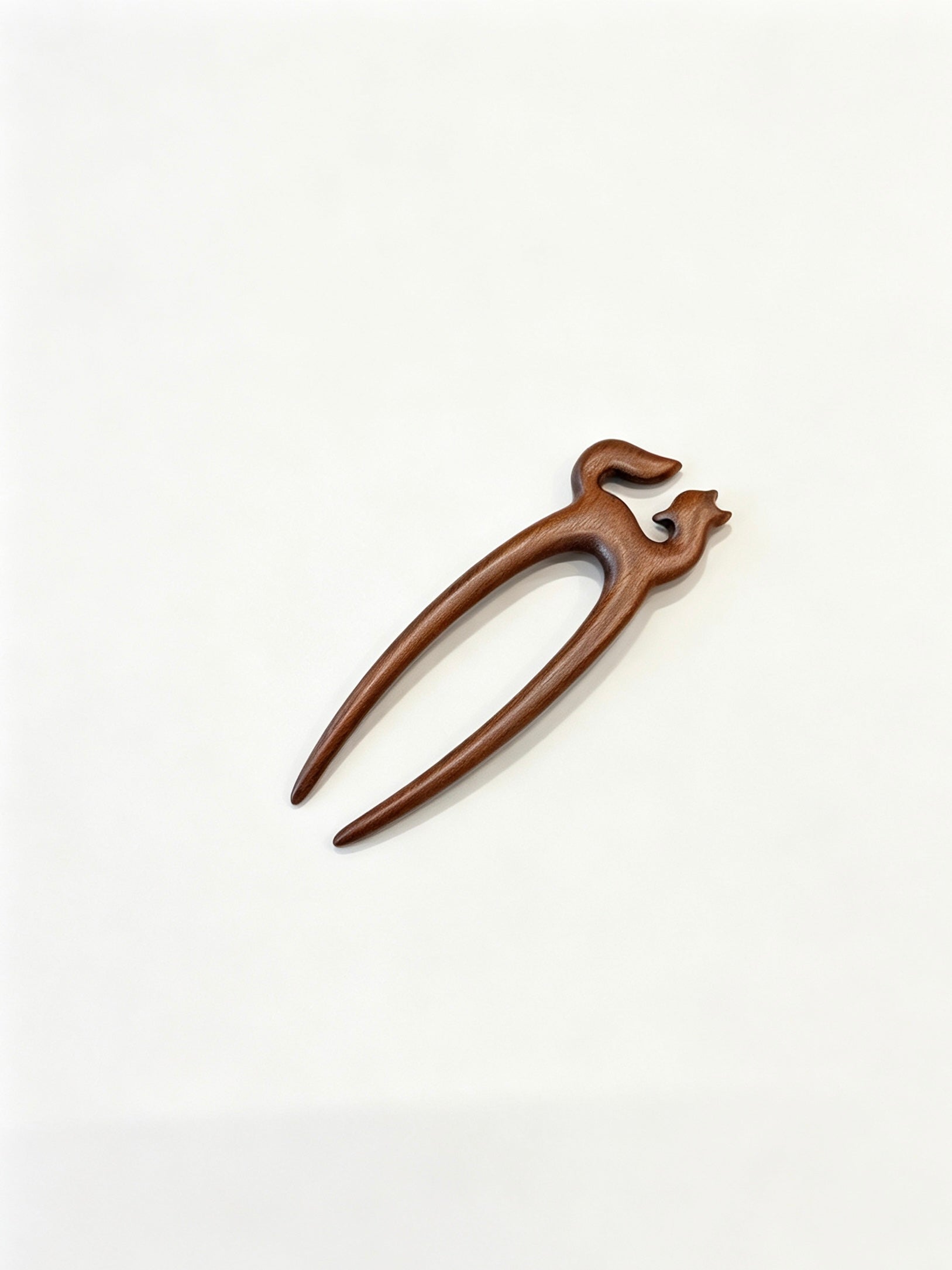 Fox double-prong hair fork displayed on a white background