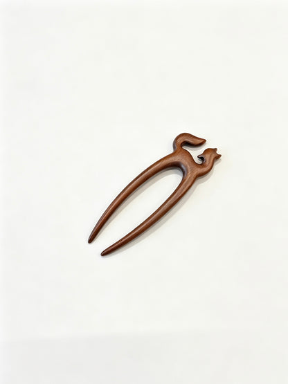 Fox double-prong hair fork displayed on a white background