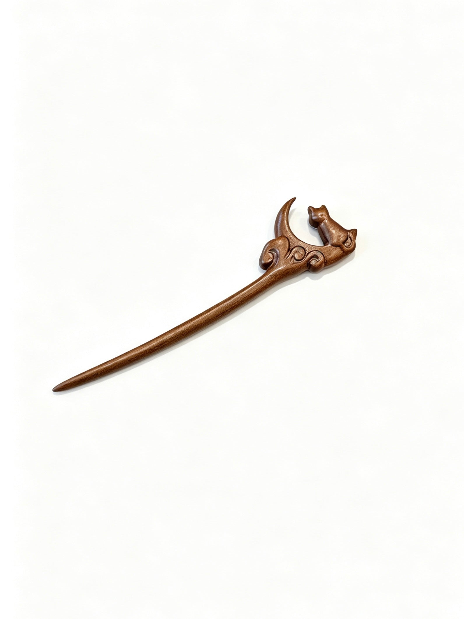 Moon gazing cat sandalwood hair stick displayed on a white background