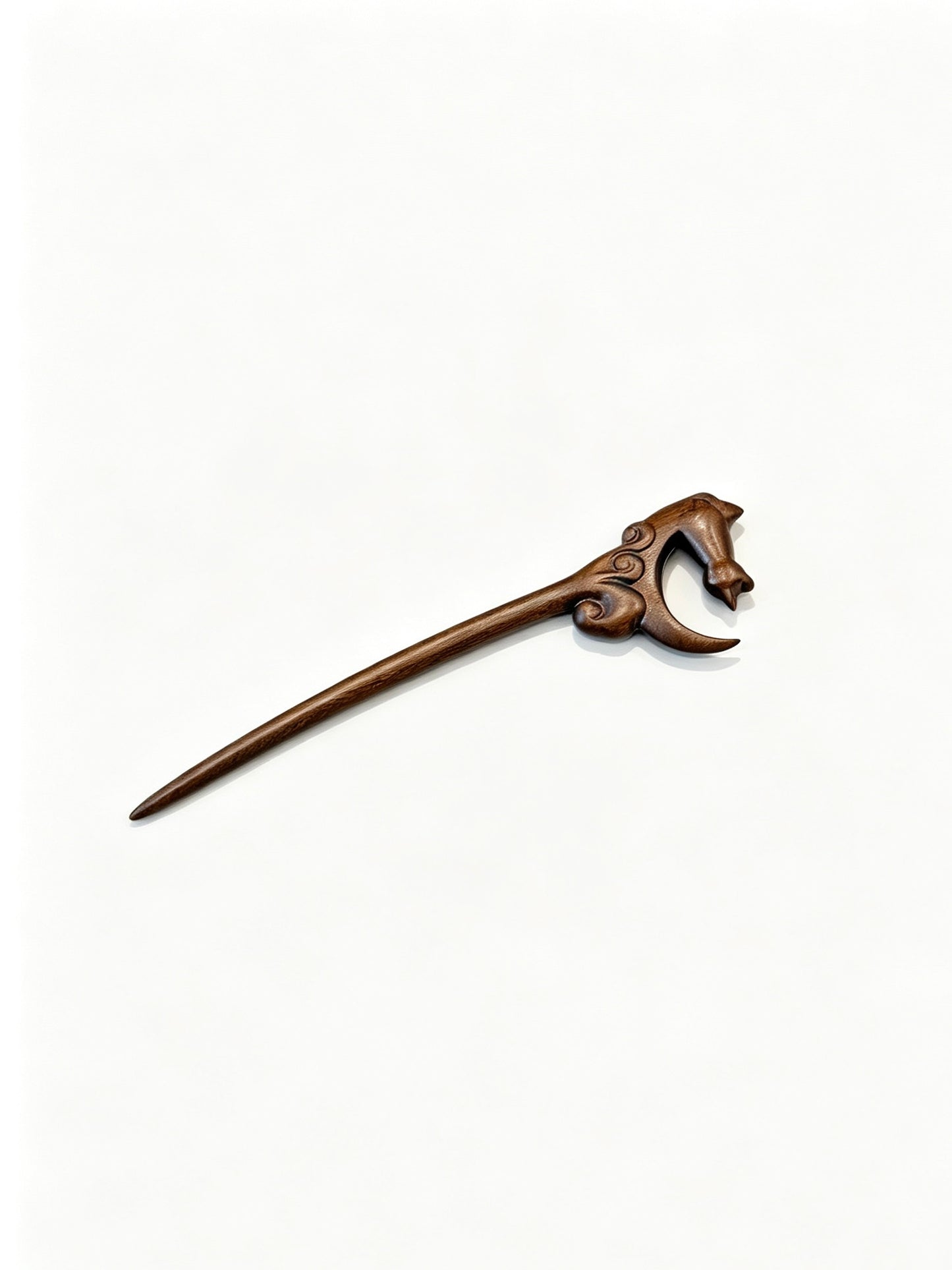 Moon gazing cat sandalwood hair stick displayed on a white background