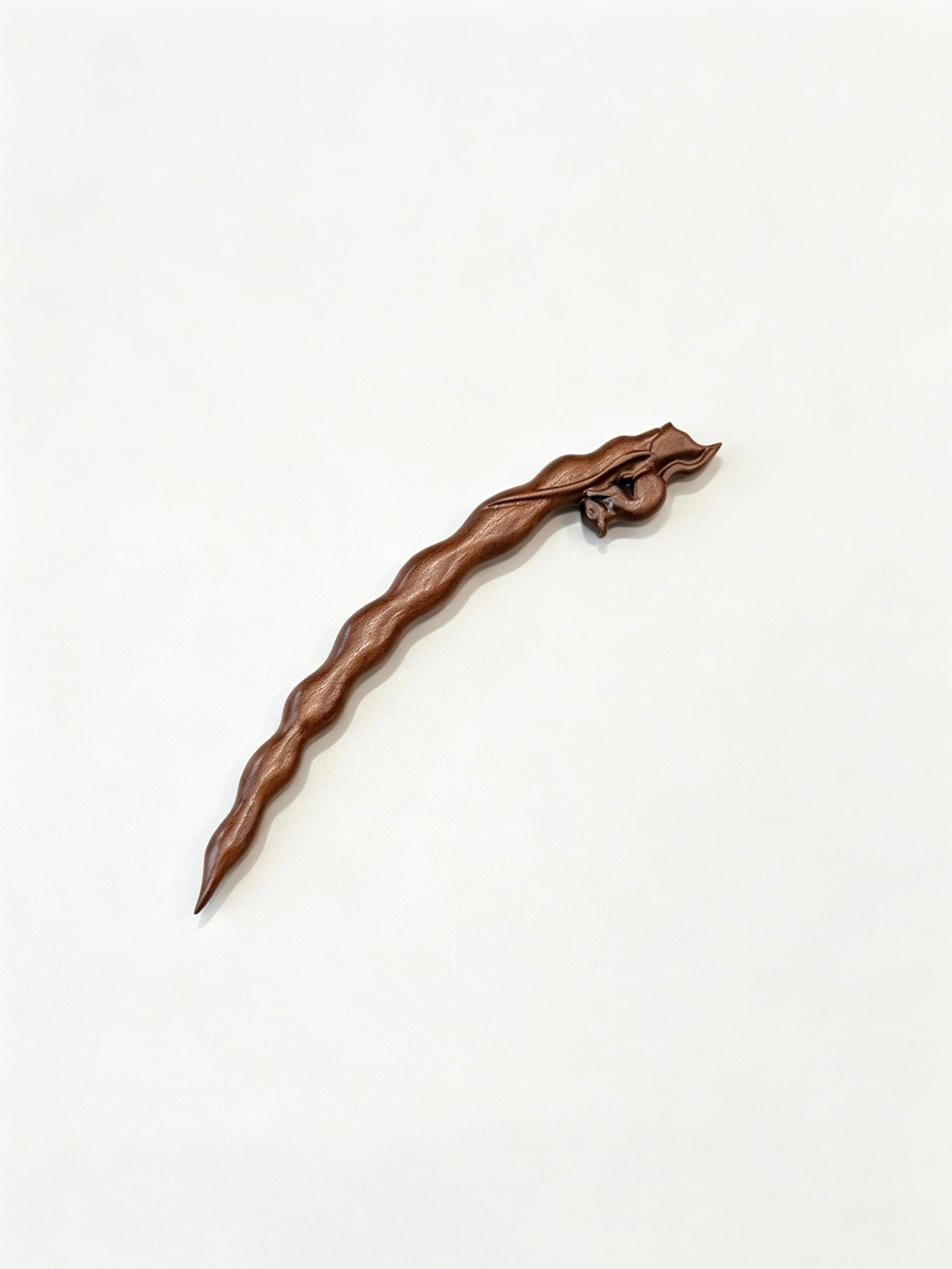 Squirrel peapod sandalwood hair stick displayed on a white background